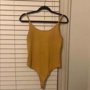 yellow bodysuit